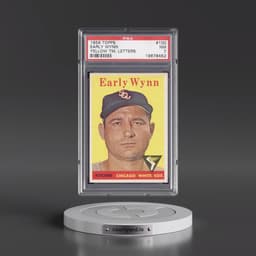 1958 Topps #100 Early Wynn - Yellow TM. Letters (PSA 7 NM)