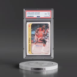 1986 Fleer Sticker #11 Dominique Wilkins (PSA 8 NM-MT)